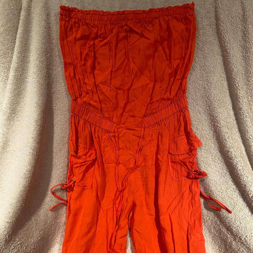 orange sleeveless jumpsuit